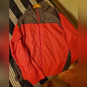 Red and black Columbia rain jacket. Size XL. Never worn